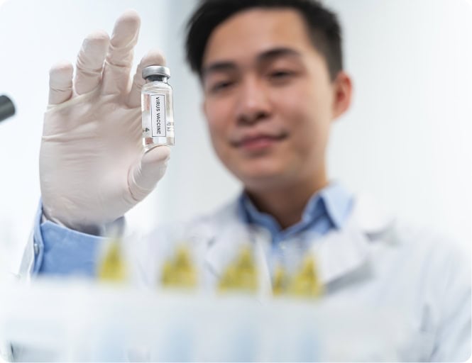 Scientist holding a vial