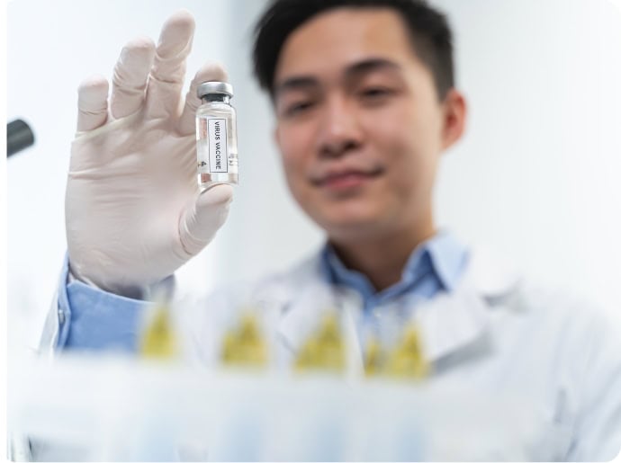 Scientist holding a vial