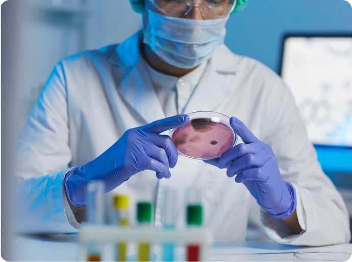 Scientist holding a vial